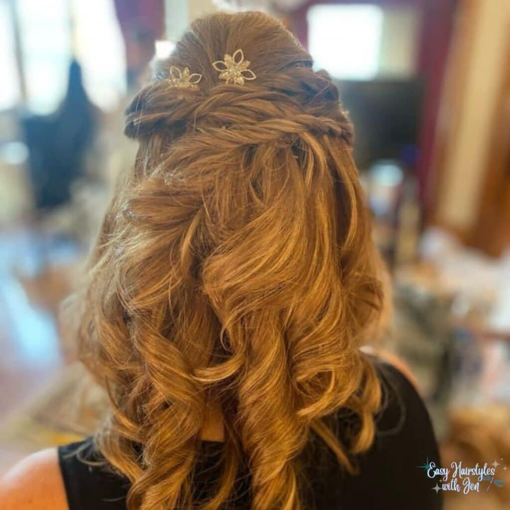 A woman with long brown wavy hair, the top half of her hair is pulled back and secured with Lilla Rose bobby pins in a crisscrossed shape. under the heading Lilla Rose Accessories-What are they for the article Get Your Hair Game On Point with Lilla Rose Accessories - Say Goodbye to Bad Hair Days!